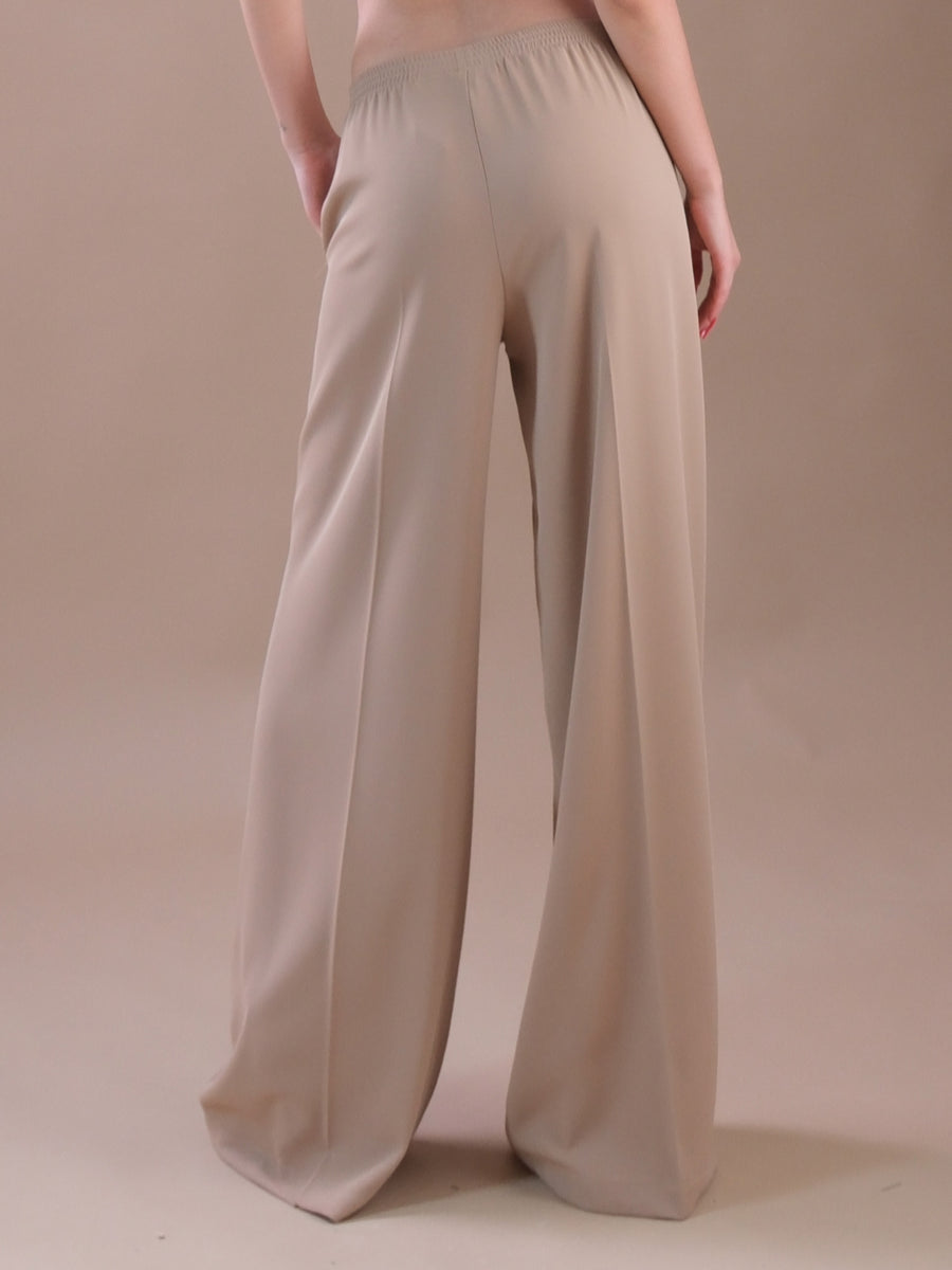 Pantaloni beige a palazzo con vita elasticizzata